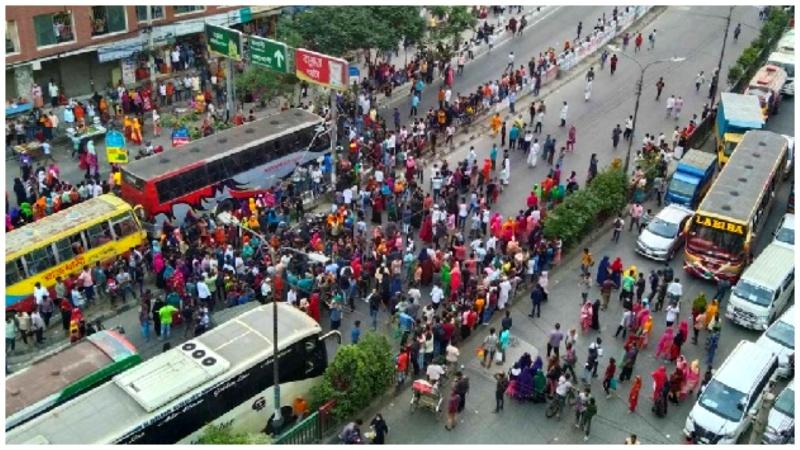 RMG workers stage demo on Bishwa Road demanding ARREARS