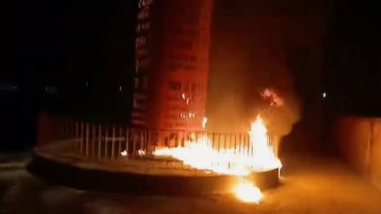 Miscreants set fire to July memorial, 2 police closed