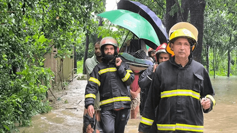 Fire service rescues pregnant woman amid chest-deep floodwaters in Chattogram