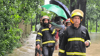 Fire service rescues pregnant woman amid chest-deep floodwaters in Chattogram