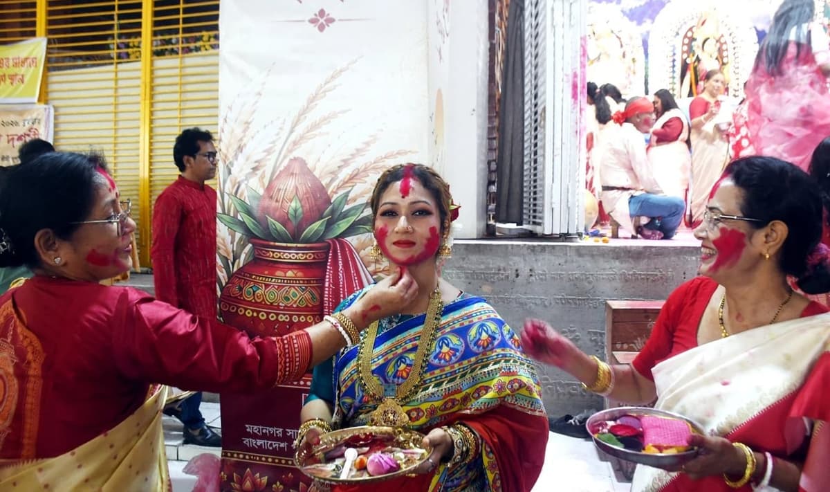 Bijoya Dashami being celebrated with traditional Sindur Khela at mandaps