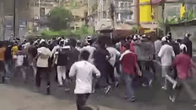 Jubo League activists protest in Chattogram with shrouds on heads