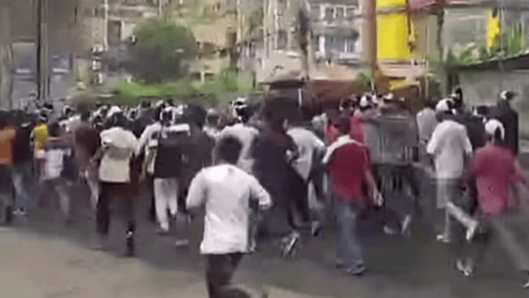 Jubo League activists protest in Chattogram with shrouds on heads