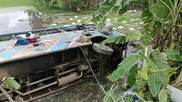Bus overturns in ditch after collision with truck, 19 injured