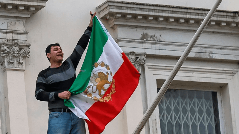 Iranian flag torn down at London embassy during protest