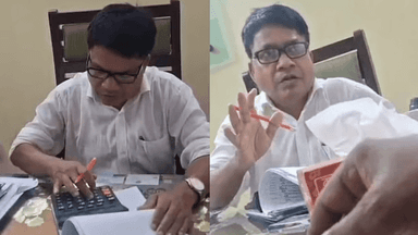 Video of government official calculating bribes on calculator goes viral