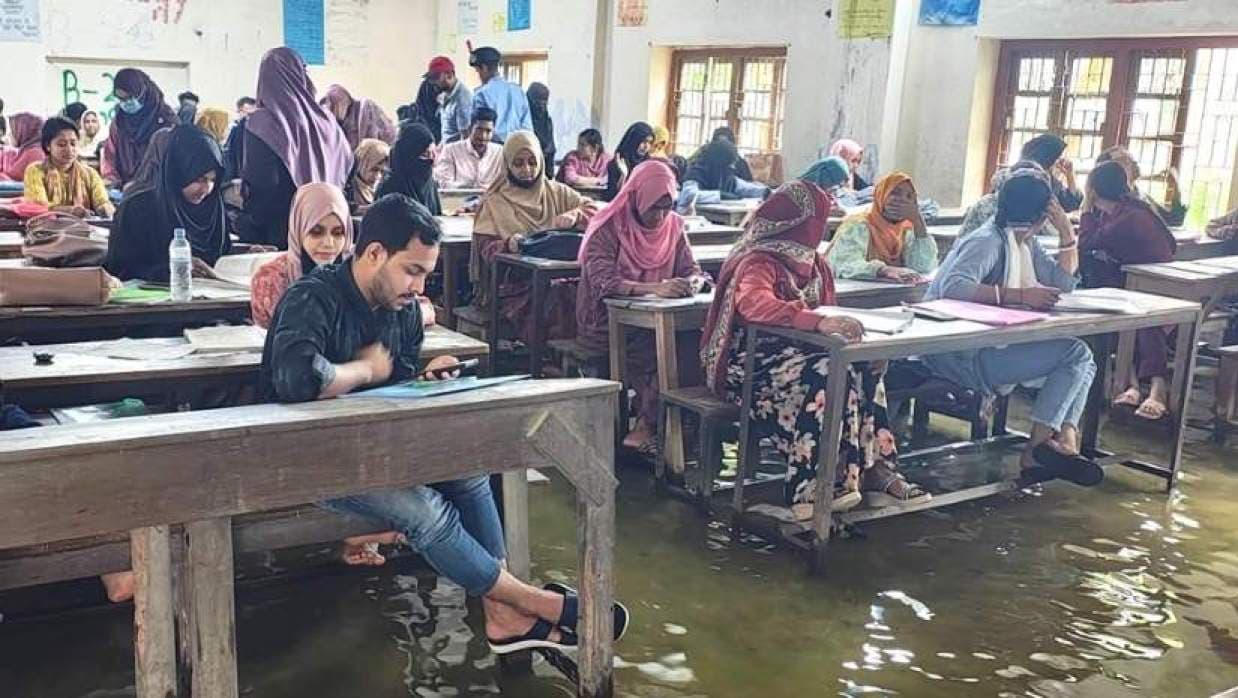 Students sit honors final exams in knee-deep water in Cumilla