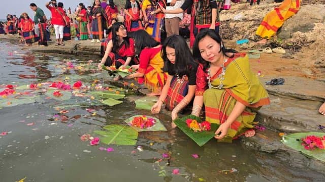 Flowers float on Kaptai Lake during Biju festival