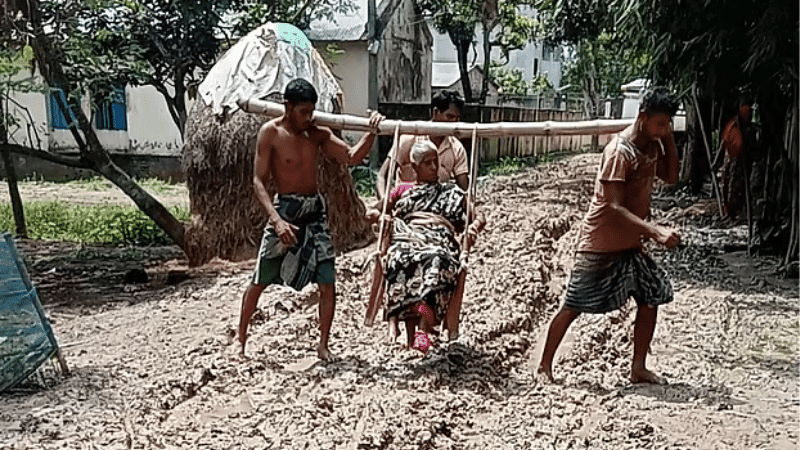 Sons carry mother through mud on bamboo chair to seek treatment