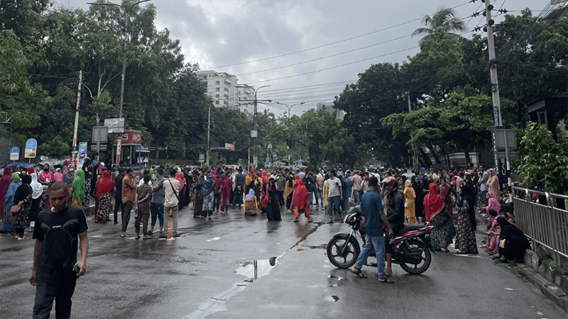  Garment workers block road in Tejgaon, halting traffic