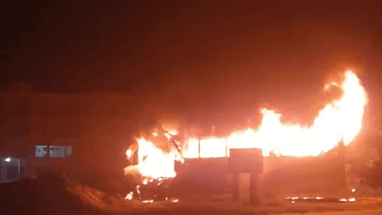 Seized bus catches fire beside highway police station in Faridpur
