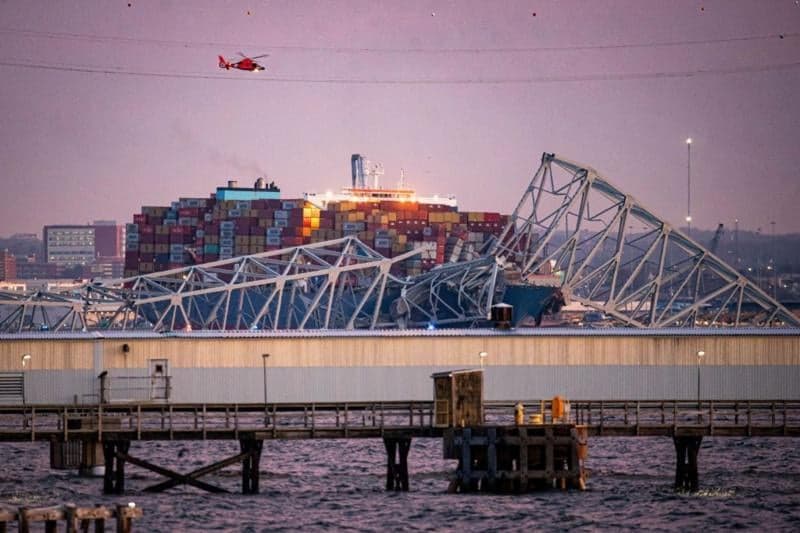 Baltimore bridge collapse: Rescuers search water after ship collision