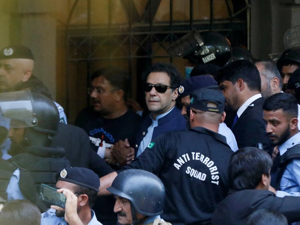 Pakistan court orders Imran Khan to appear in public trial