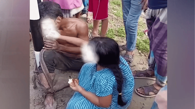 Little girl feeds tea-bread to father tied to post all night, released after video spreads