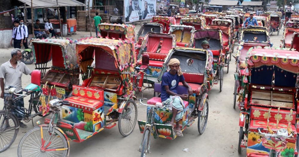 auto-rickshaw drivers clearing the roads.