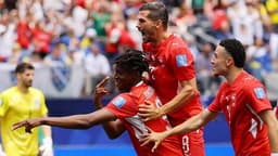 Switzerland beat 10-man Bosnia behind Manzambi double