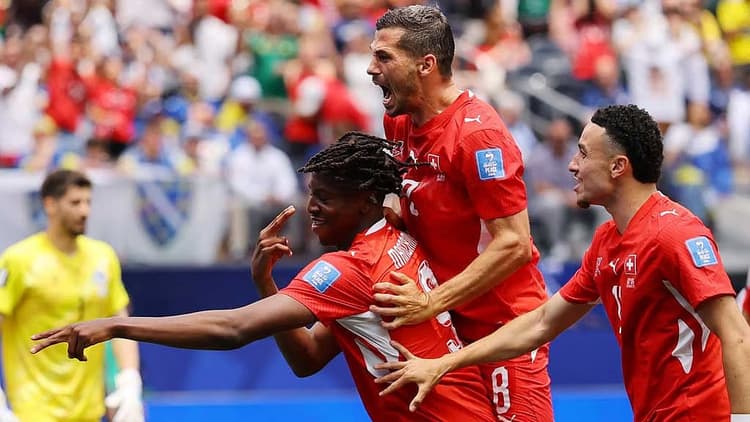 Switzerland beat 10-man Bosnia behind Manzambi double