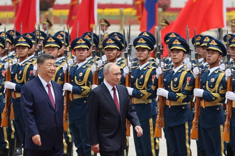Xi and Putin hold talks in Beijing after Trump’s visit ends